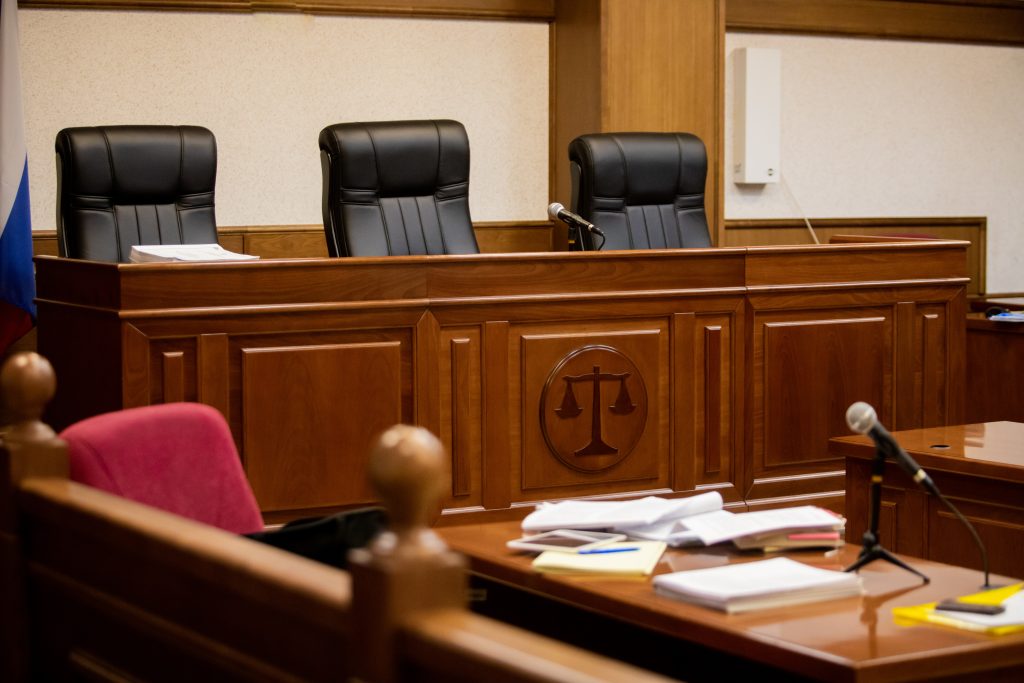 A courtroom with an empty judge’s chair to illustrate protesting your property taxes in texas A courtroom with an empty judge's chair to illustrate protesting your property taxes in texas in an ARB hearing