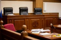 A courtroom with an empty judge's chair to illustrate protesting your property taxes in texas in an ARB hearing