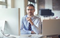 Portrait, pen and business man by computer; property tax experts
