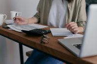 Homeowner calculating taxes and ways to achieve a lower tax bill