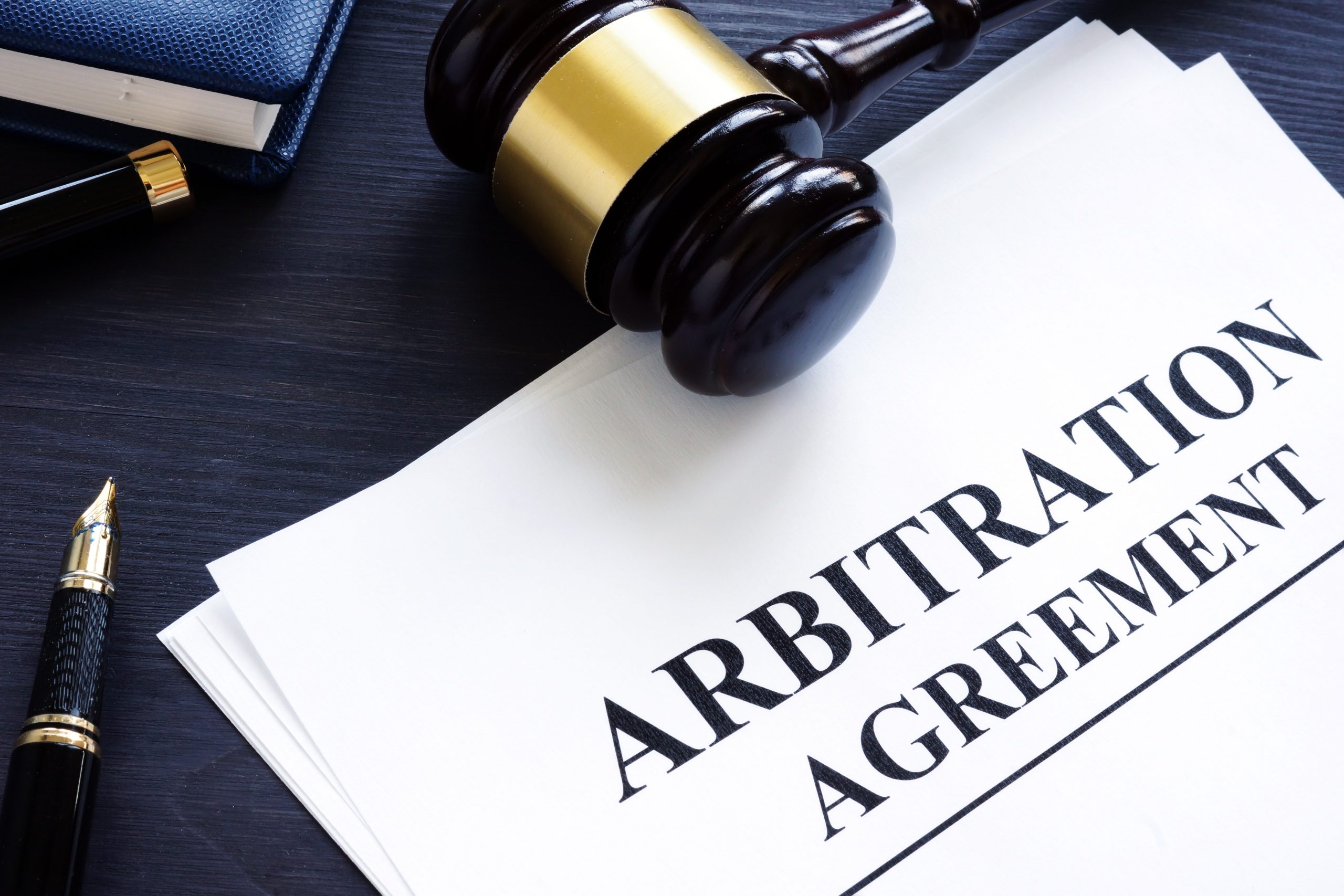 Arbitration agreement and gavel on a desk; texas property tax arbitration