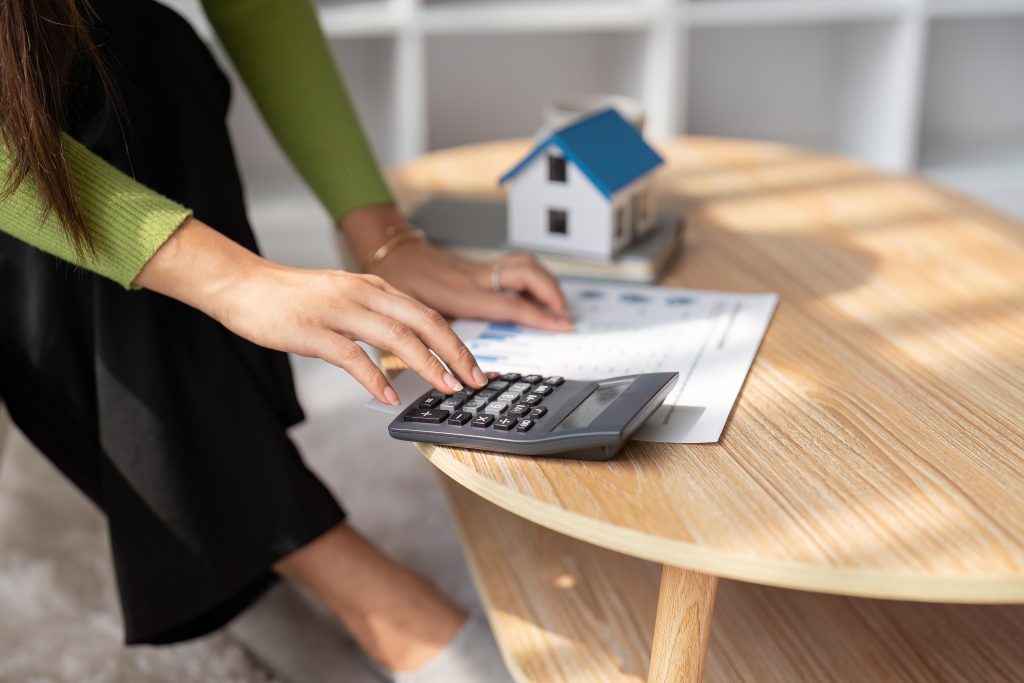 Woman renter using calculator for property tax bills