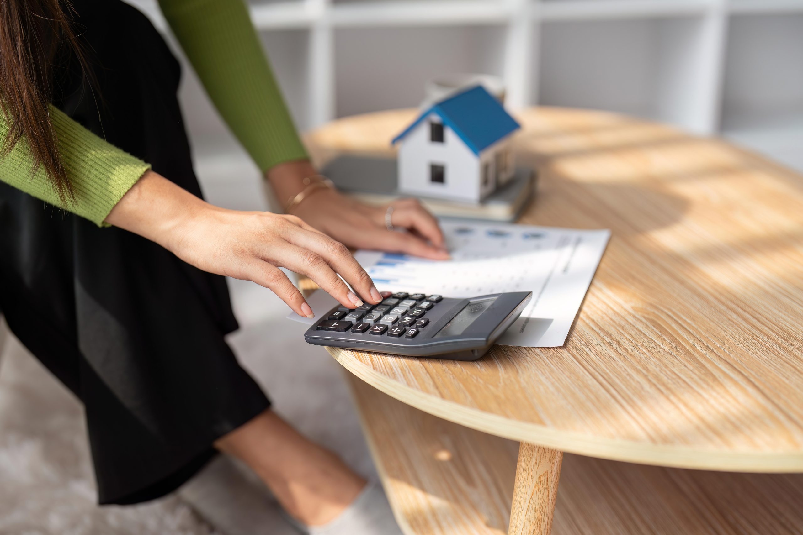 Woman renter using calculator for property tax bills